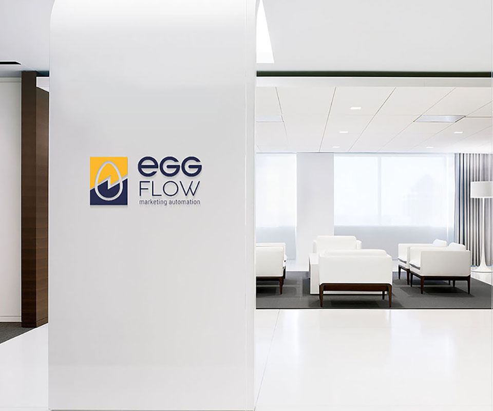 The EggFlow logo on signage inside an office space