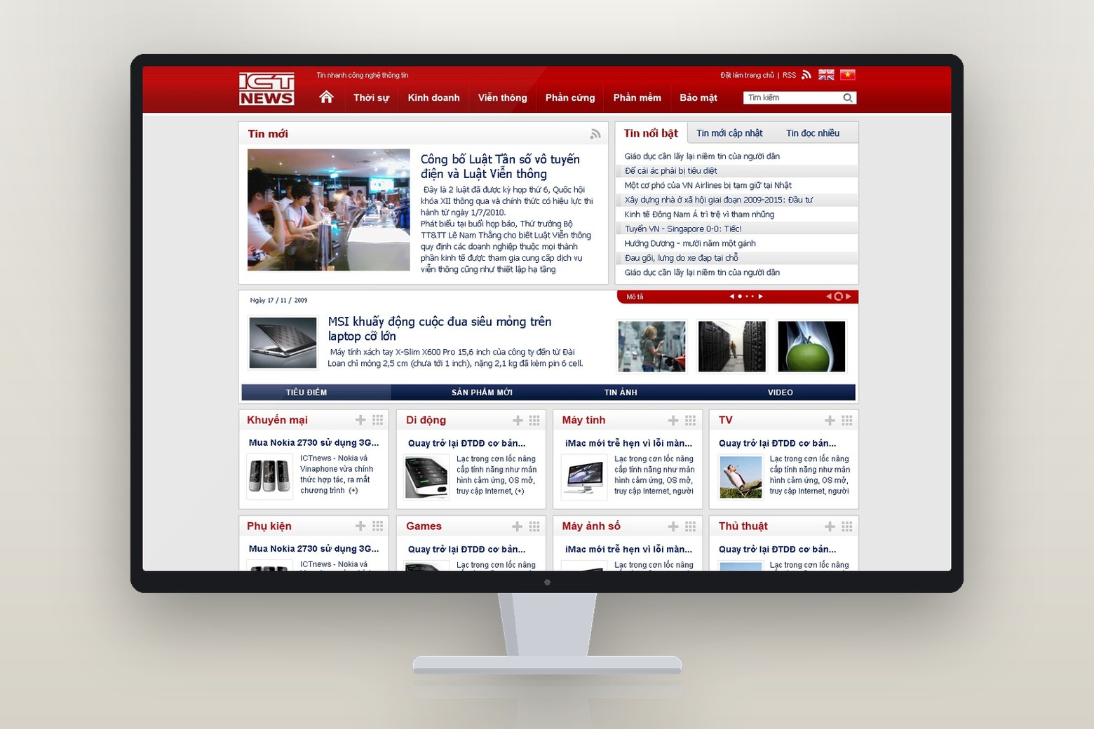 The ICTnews home page on a desktop monitor