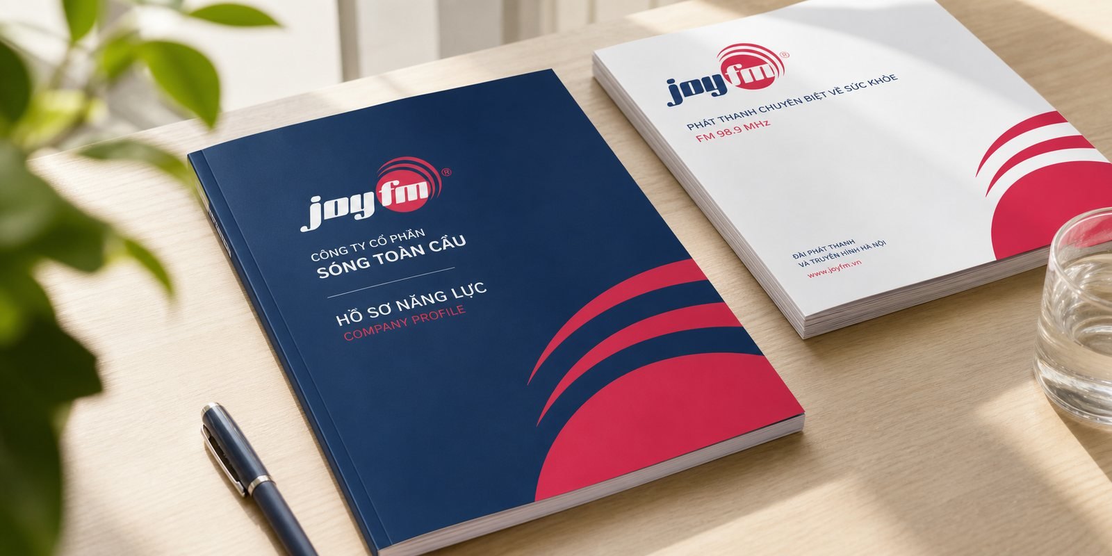Bìa catalogue JoyFM với motif sóng và bảng màu thương hiệu