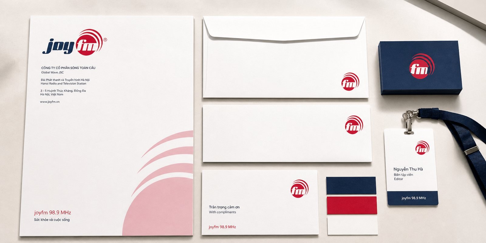 Corporate stationery The JoyFM stationery set: business cards, letterhead and envelopes carrying the mark