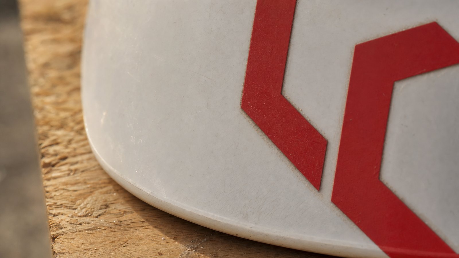 The mark on a helmet shell Close view of the cut vinyl edge of the mcdi mark on a helmet shell