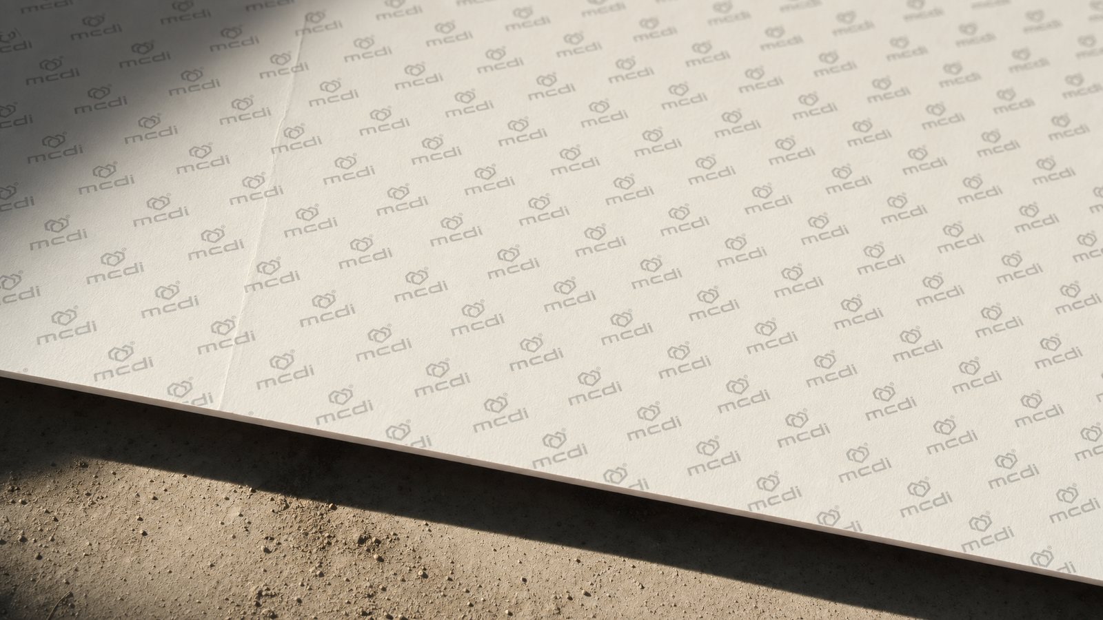 Pattern under the paper The mcdi hexagon pattern printed in soft grey running diagonally across a sheet