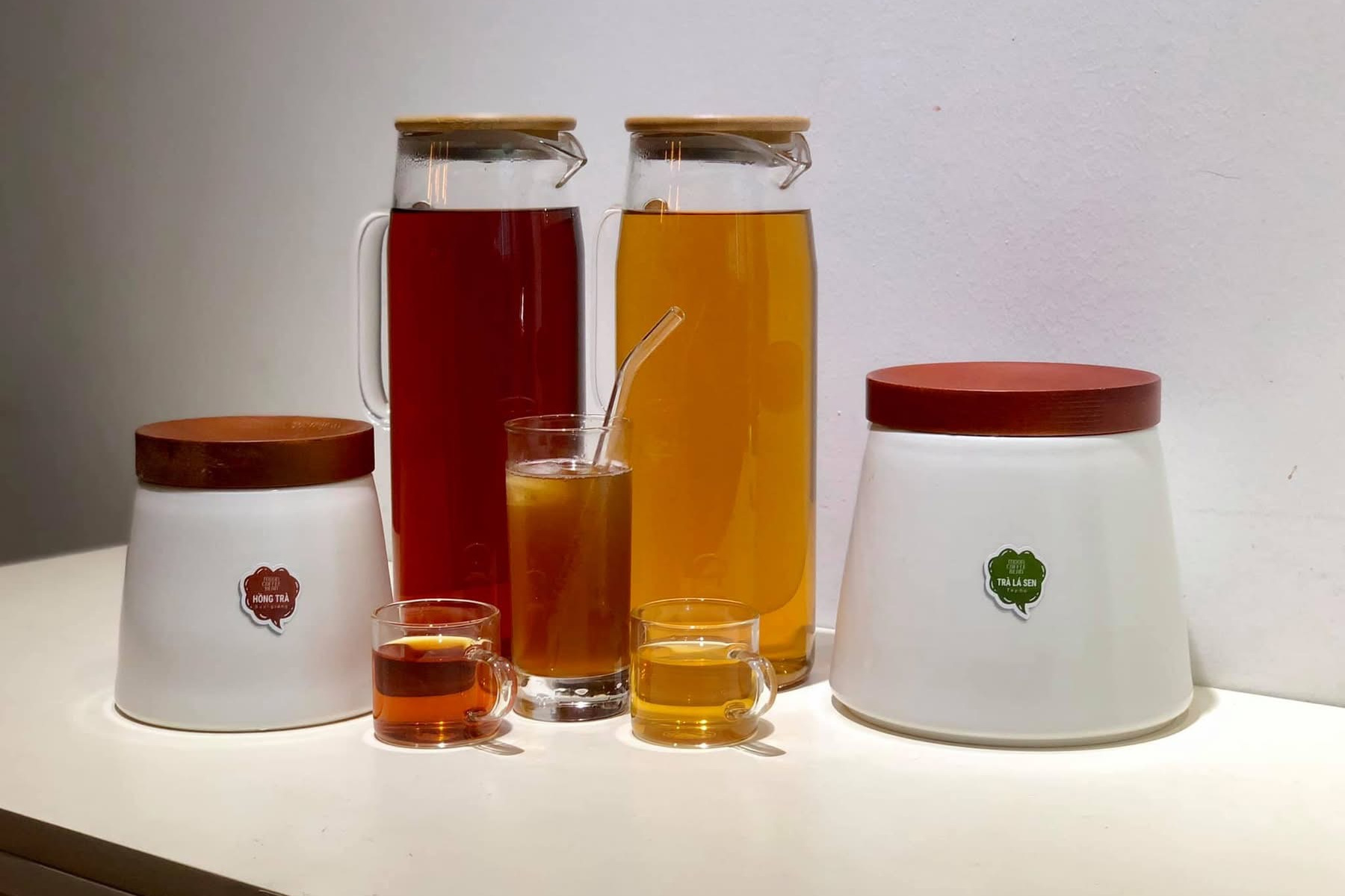 Moon Coffee Bean tea jars and ceramic canisters wearing coloured flavour tags